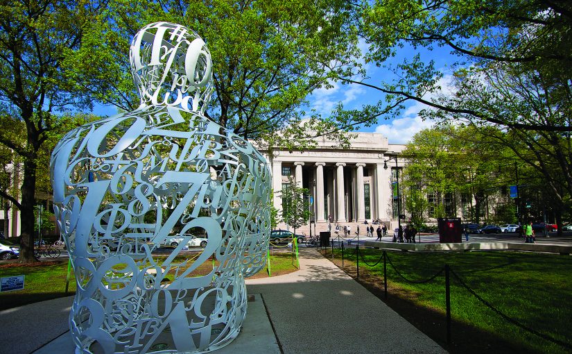 The Alchemist statue looks over the pillared Mass Ave entrance to MIT