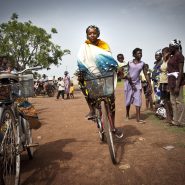 A person from Ghana riding a bicycle